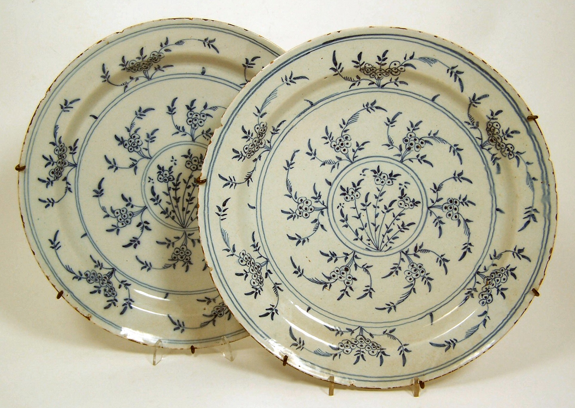A pair of 19th century English Delft circular plates