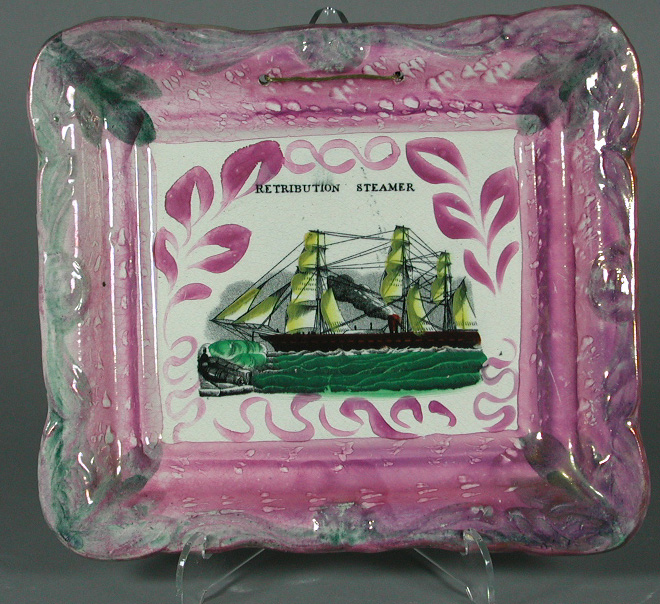 A rectangular pink lustre plaque