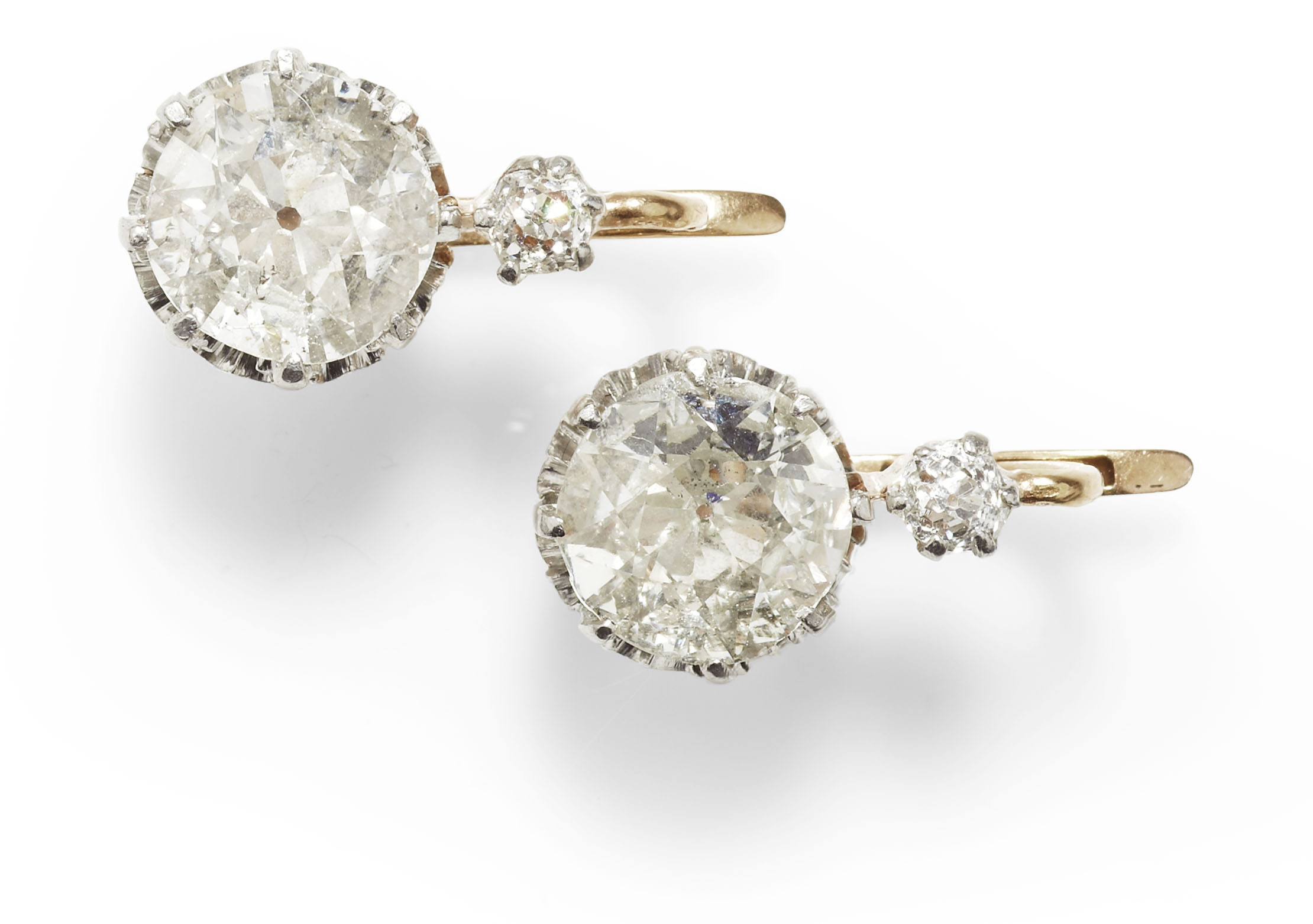 A pair of French gold mounted diamond set pendant earrings,