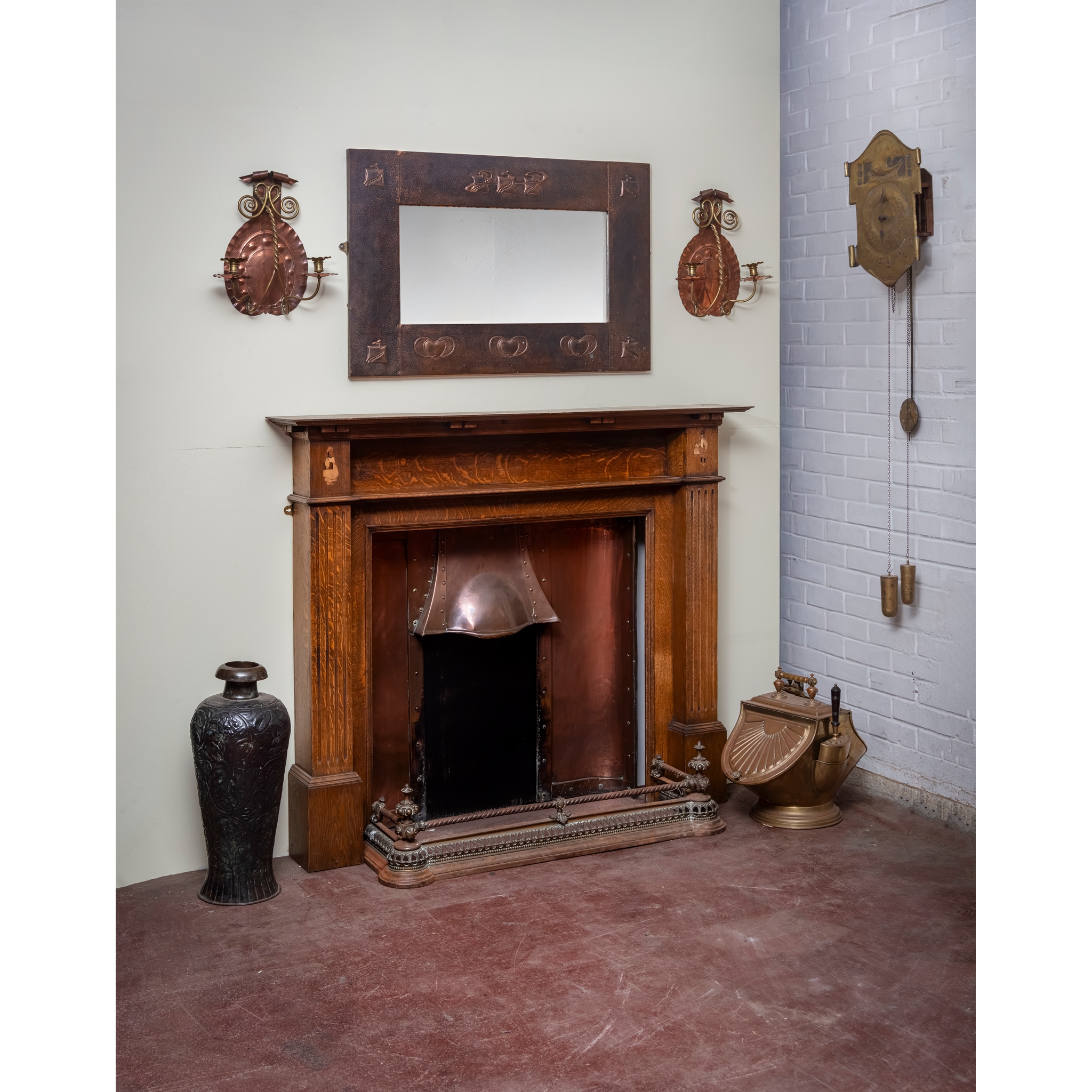 AN ARTS AND CRAFTS FIRE SURROUND AND ASSOCIATED FURNISHINGS