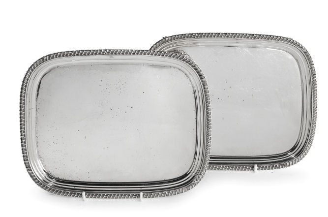 A pair of George IV silver waiters