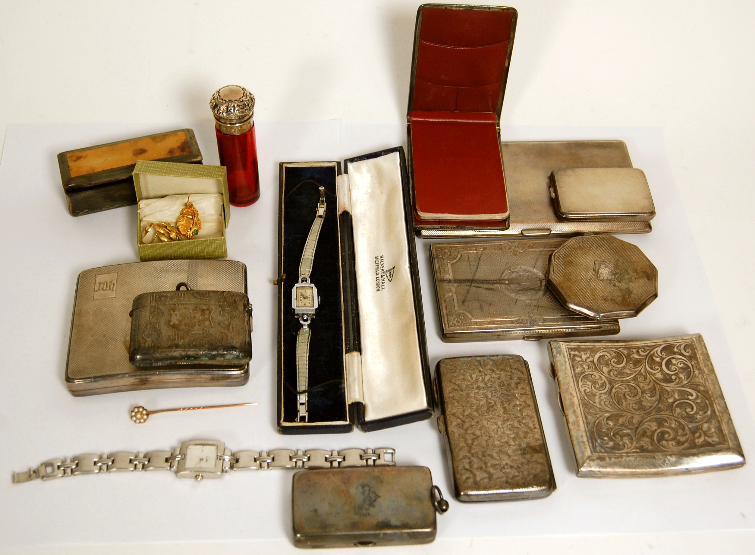 A collection of silver boxes and compacts