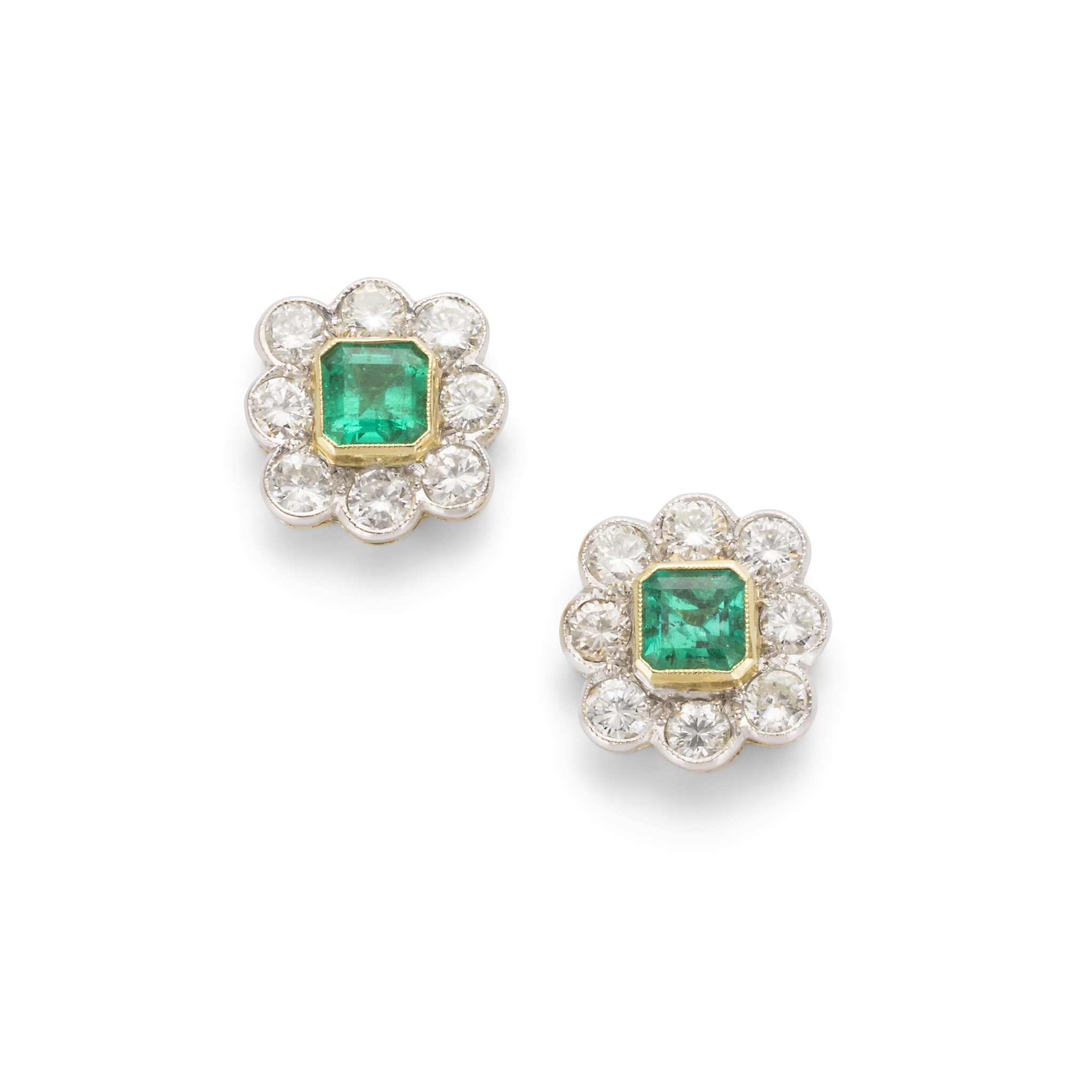 A pair of emerald and diamond cluster earrings