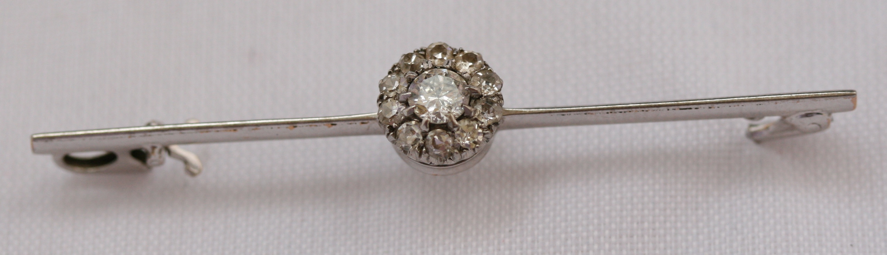 A diamond bar brooch