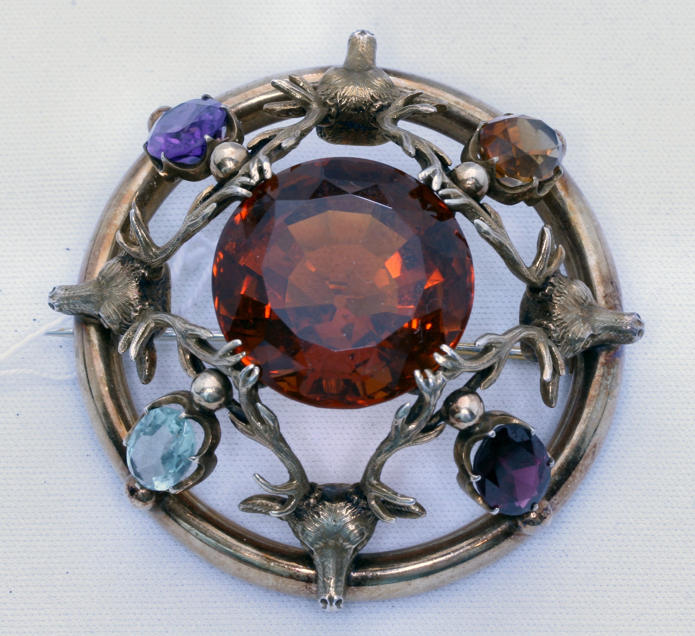 A multi-gem set plaid brooch