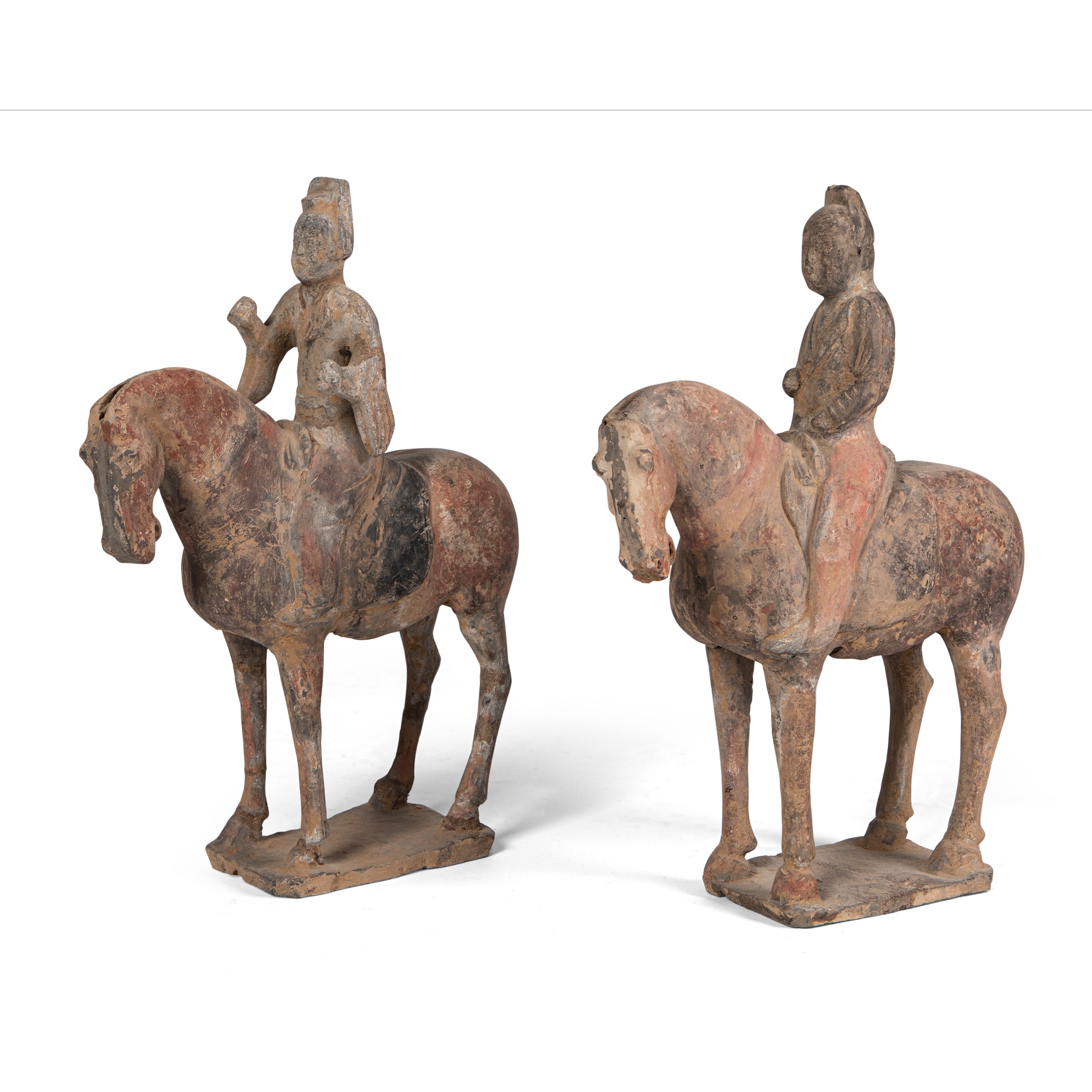 TWO POTTERY FIGURES OF EQUESTRIANS