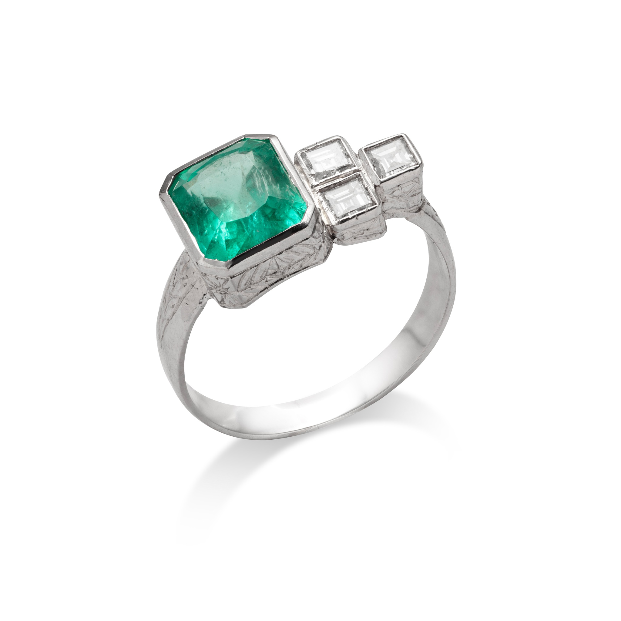An emerald and diamond ring