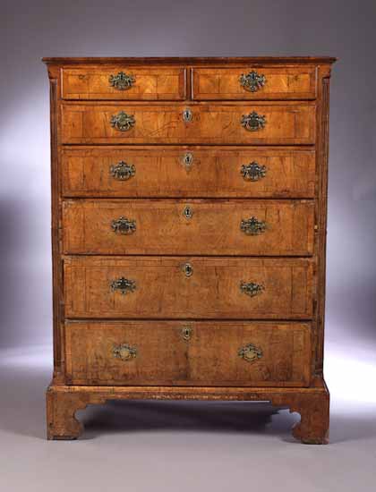 An early 18th century walnut tallboy in two parts