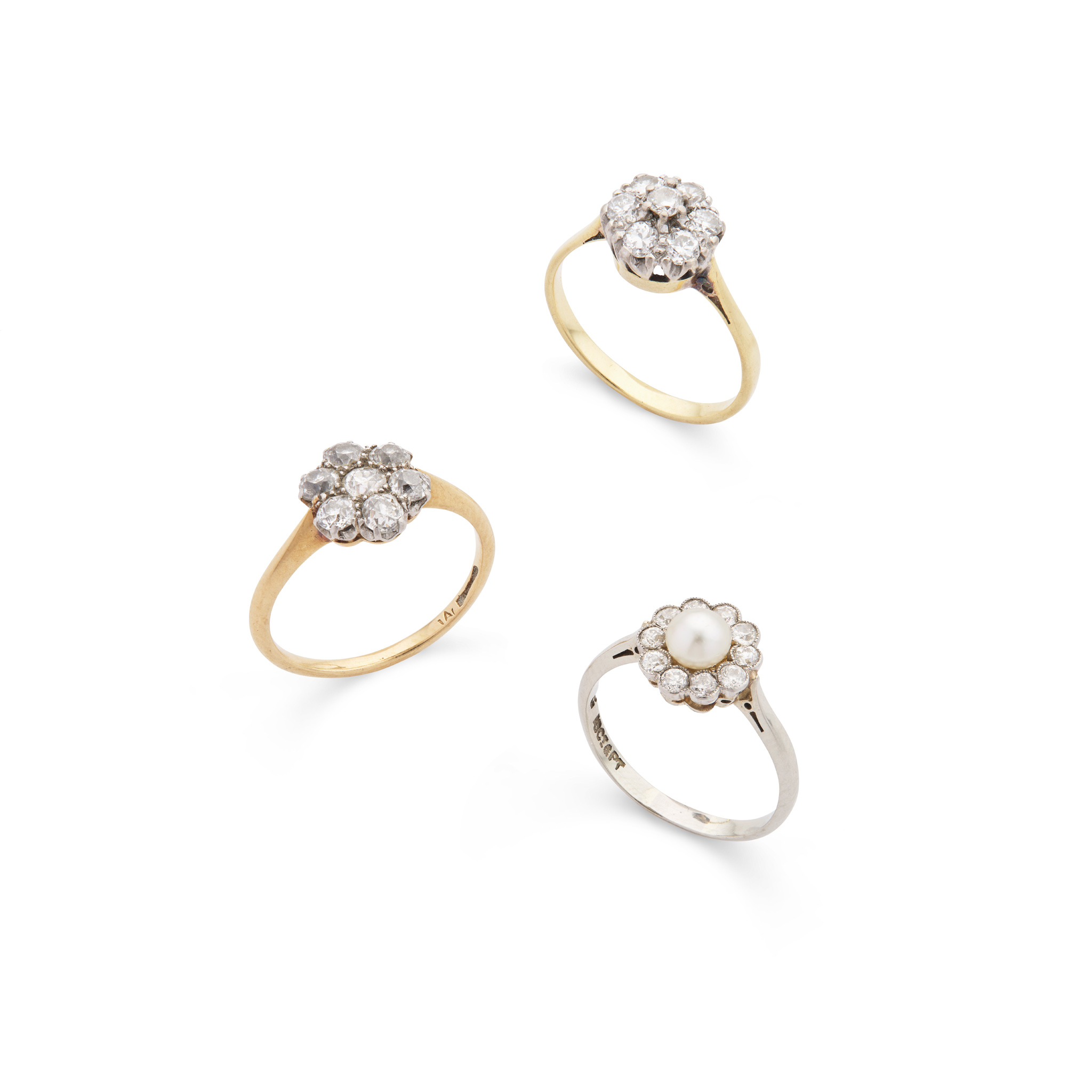 Three diamond and/or pearl cluster rings