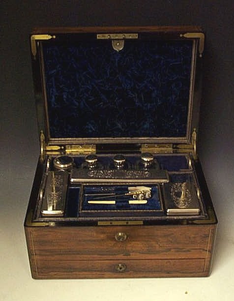 A rosewood and brass bound dressing box,