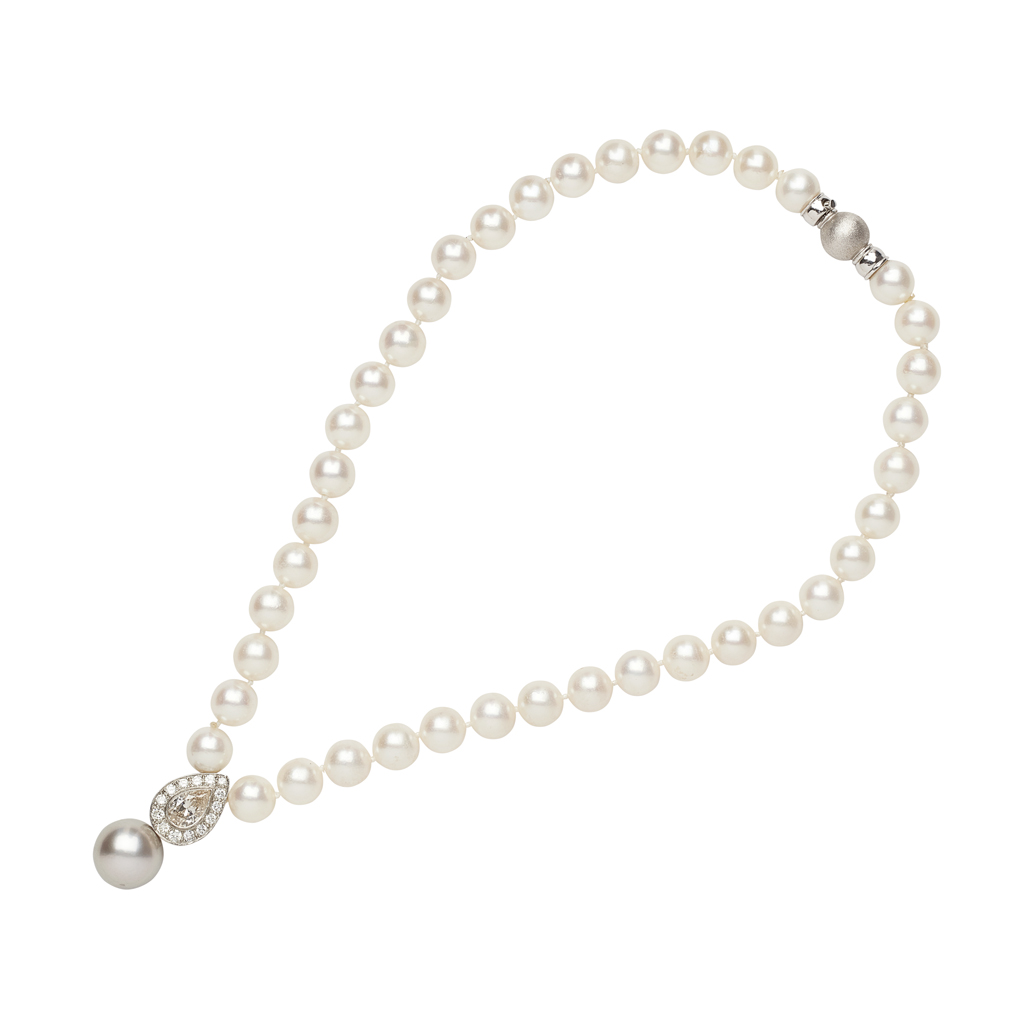 A pearl and diamond set necklace