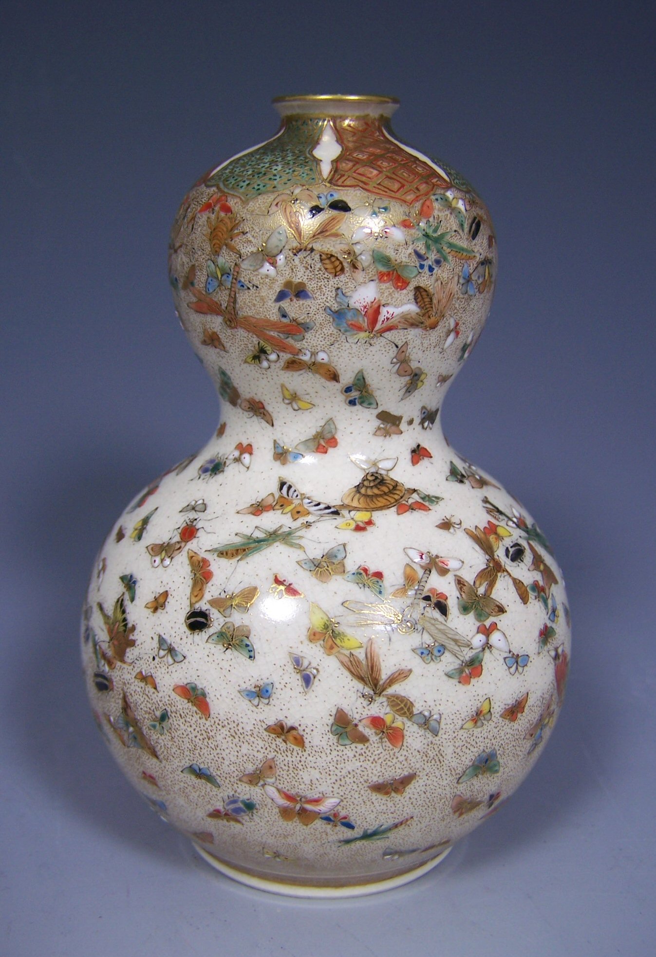 A Japanese Meiji period double gourd satsuma vase