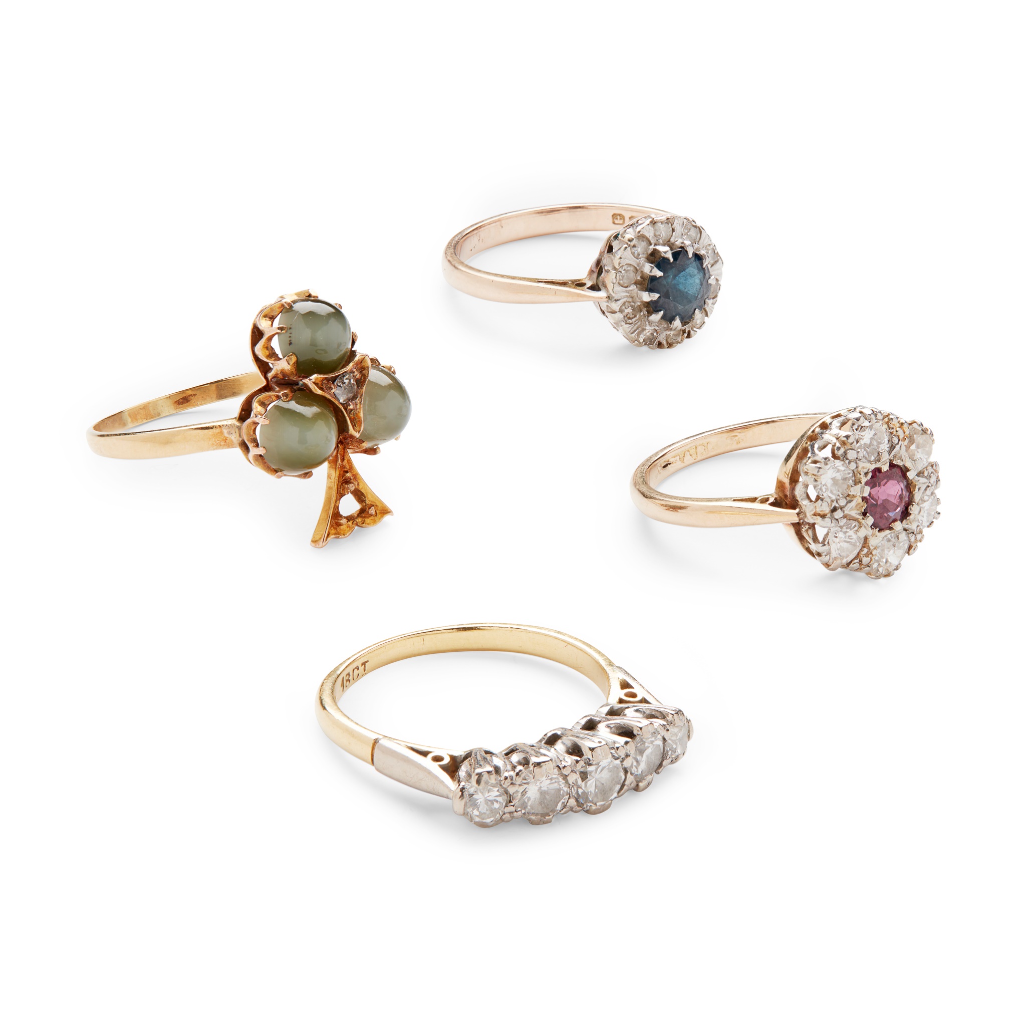 A collection of four gem-set rings