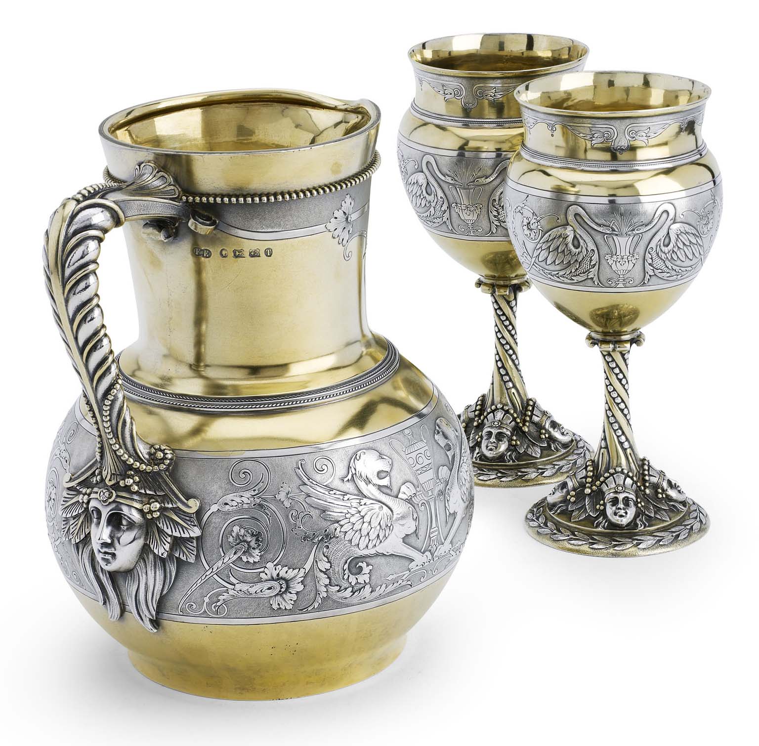 A cased Victorian parcel-gilt silver water jug and matching pair of goblets