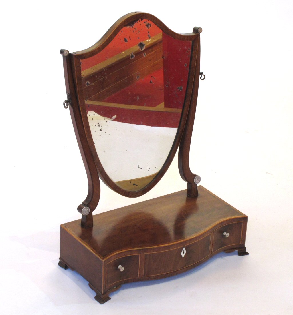 A Regency mahogany serpentine dressing mirror