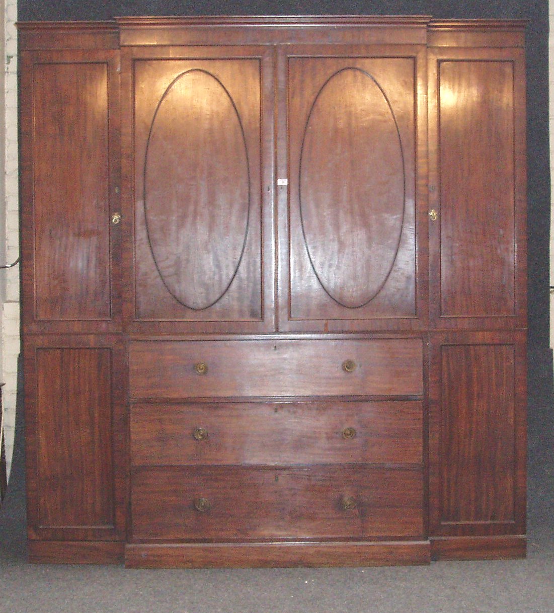 A George III mahogany breakfront wardrobe,
