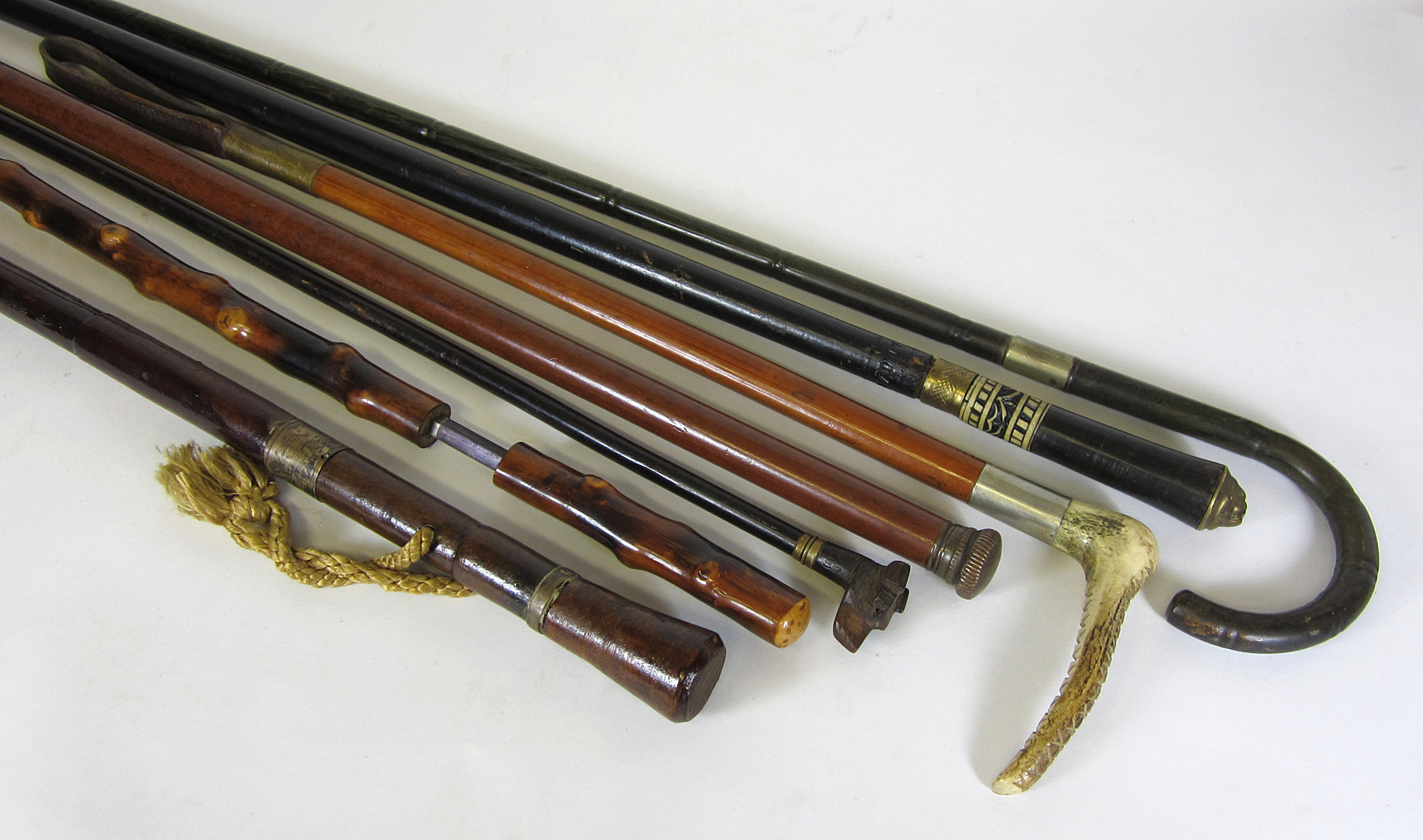 COLLECTION OF SWORD STICKS AND OTHER STICKS