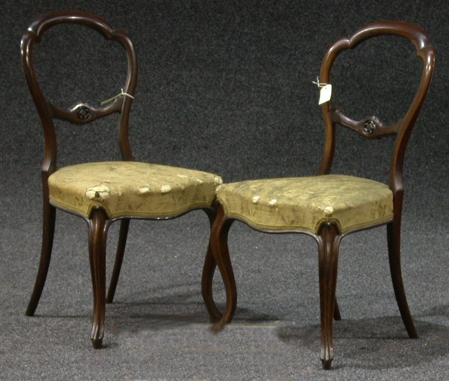 A set of six Victorian rosewood balloon back chairs,