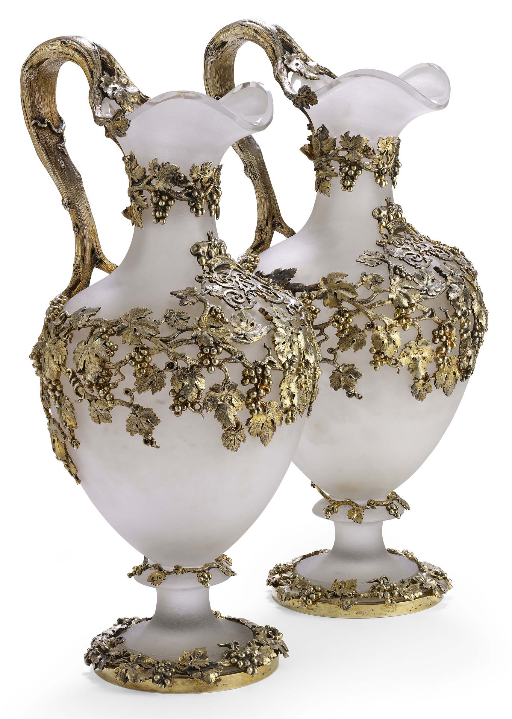 A pair of early Victorian silver-gilt mounted satin glass wine ewers