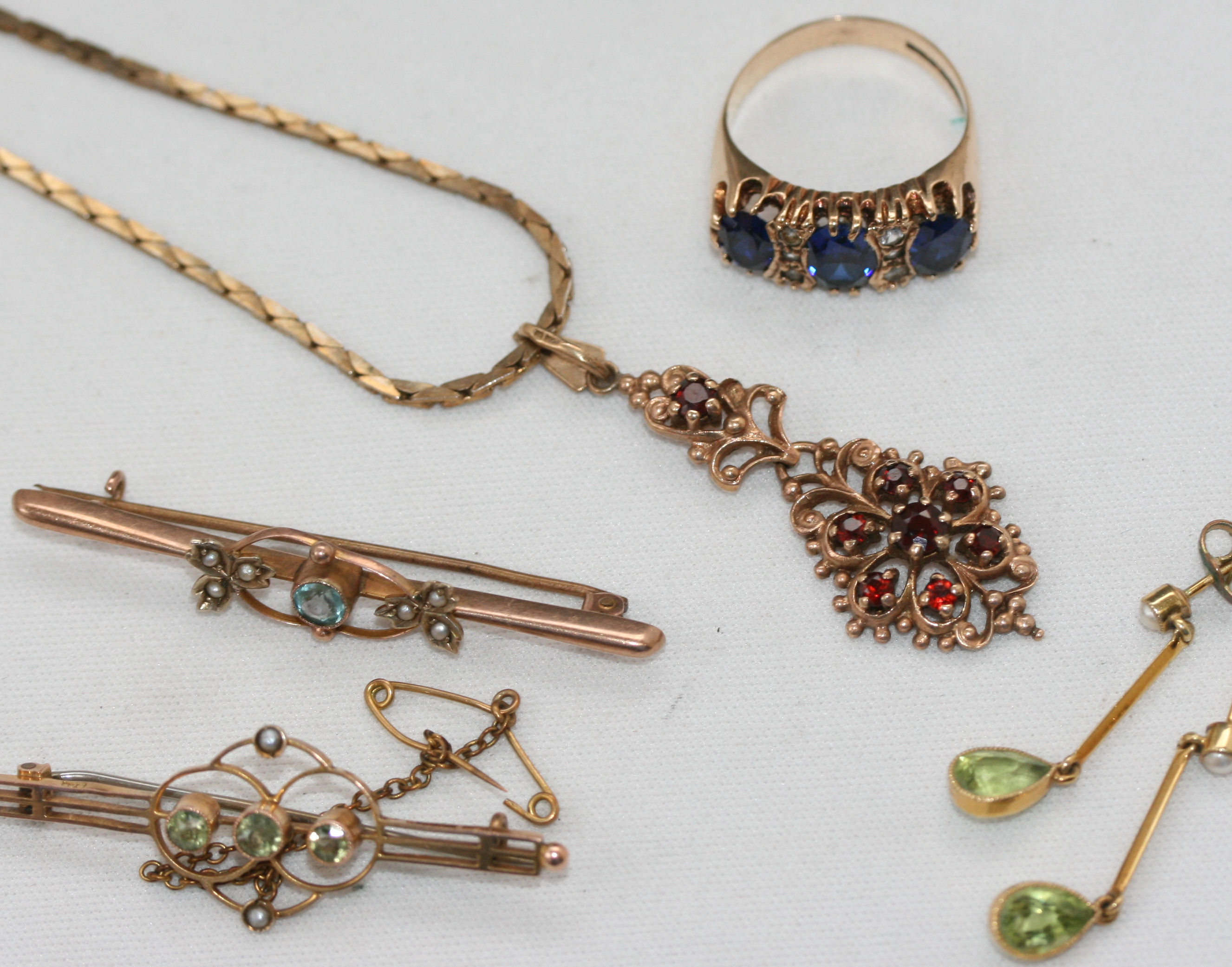 A pair of seed pearl and peridot pendant earrings