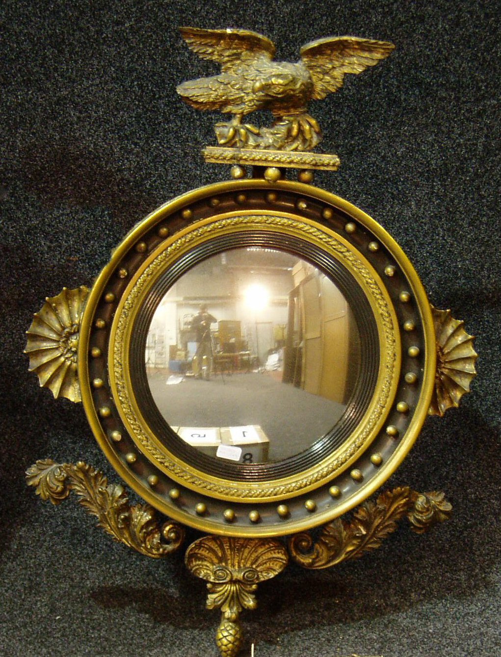A Regency gilt wood convex mirror,