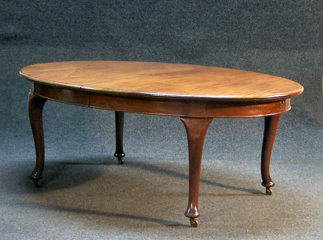 A 20th century mahogany oval extending dining table,