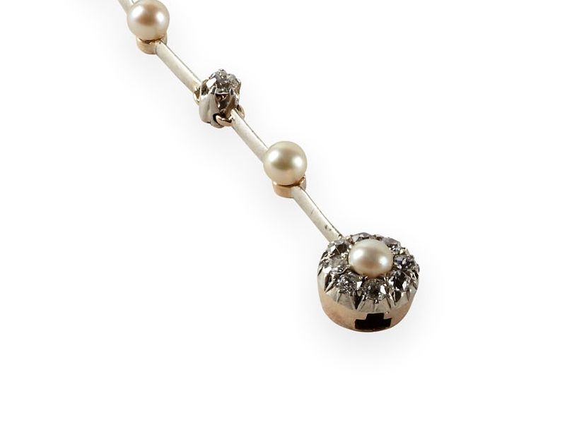 An Edwardian pearl and diamond set necklace