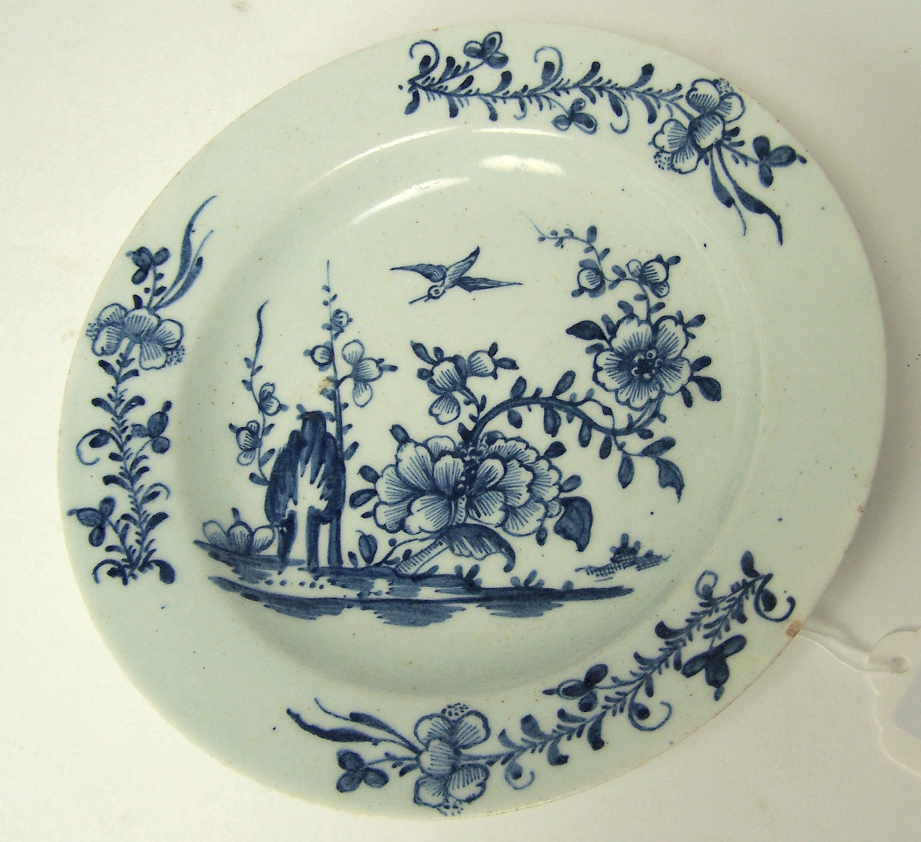 An 18th century Liverpool blue painted plate, 1765-70
