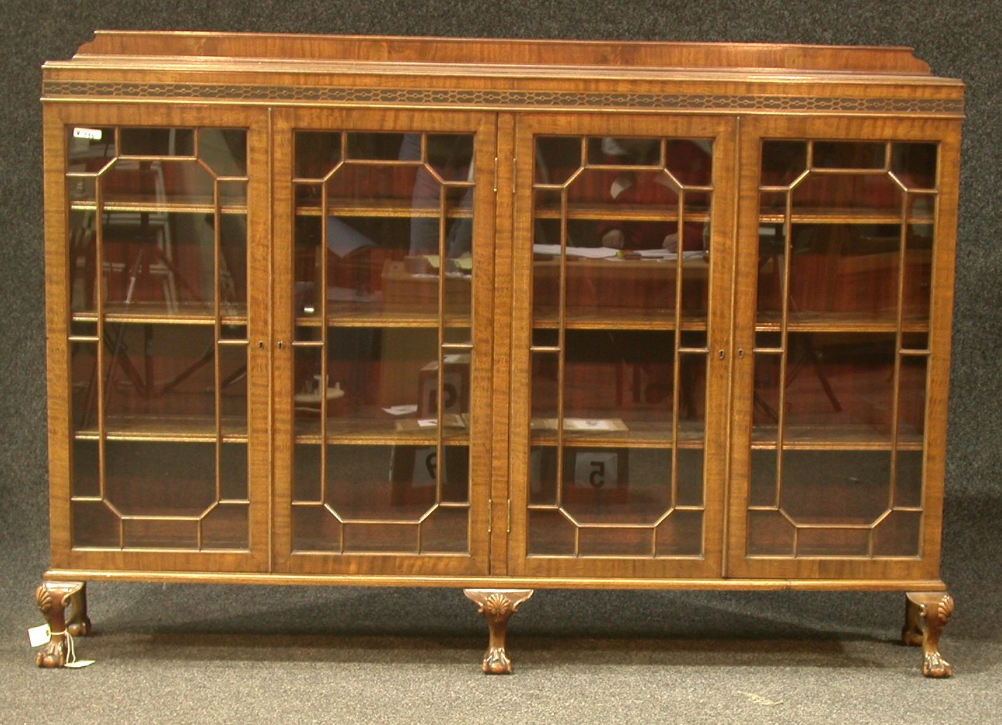 A four door mahogany dwarf bookcase,