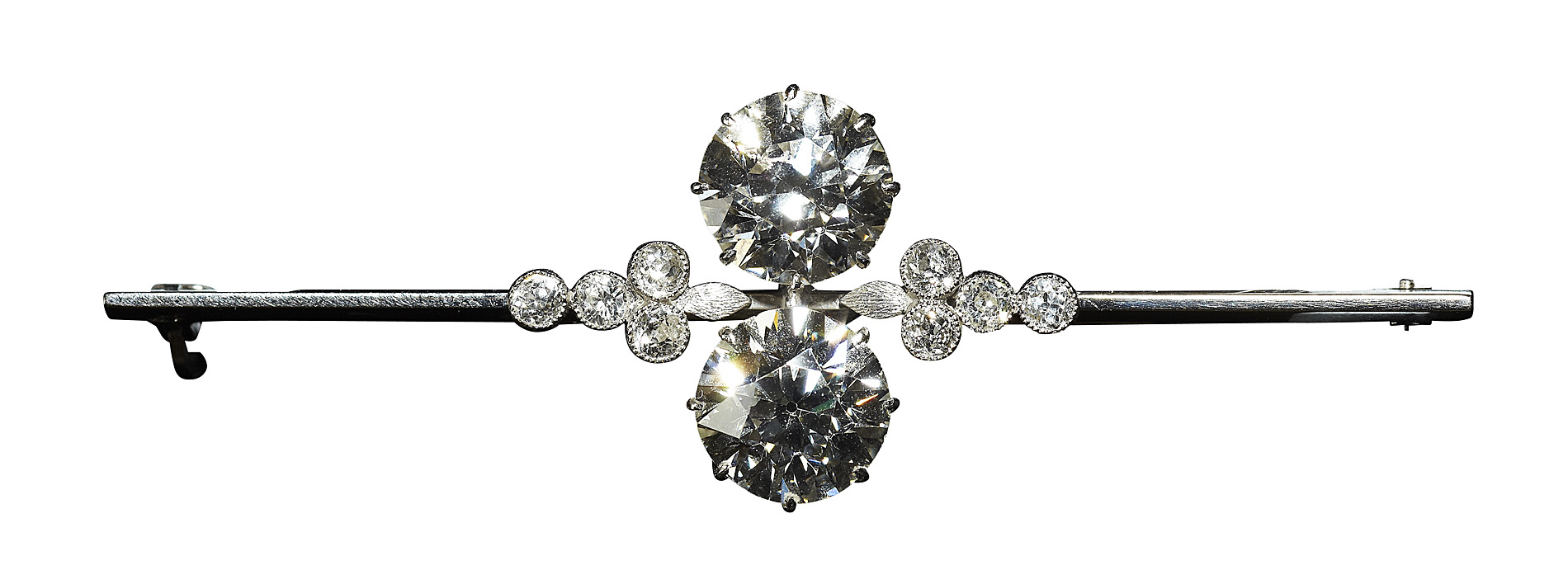 An early 20th century 9ct white gold mounted diamond set bar brooch