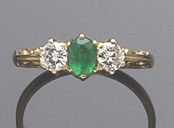 An 18ct gold mounted three stone ring,