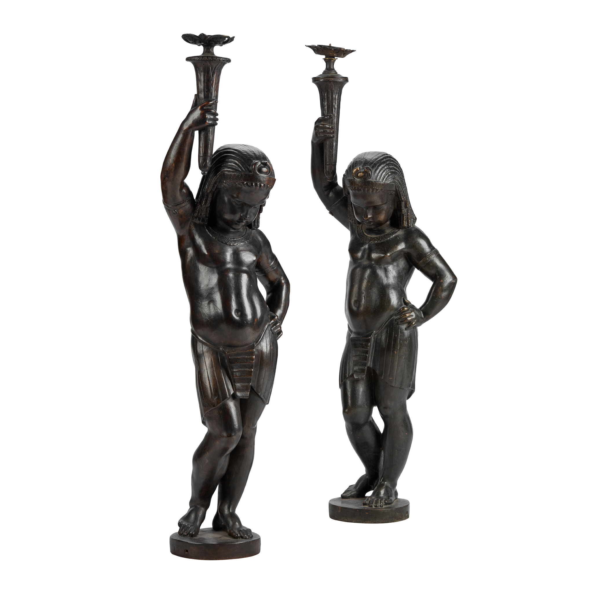 A PAIR OF FRENCH CAST IRON EGYPTIAN STYLE FIGURAL TORCHÈRES, PROBABLY VAL D'OSNE, AFTER THE MODEL BY MATHURIN MOREAU