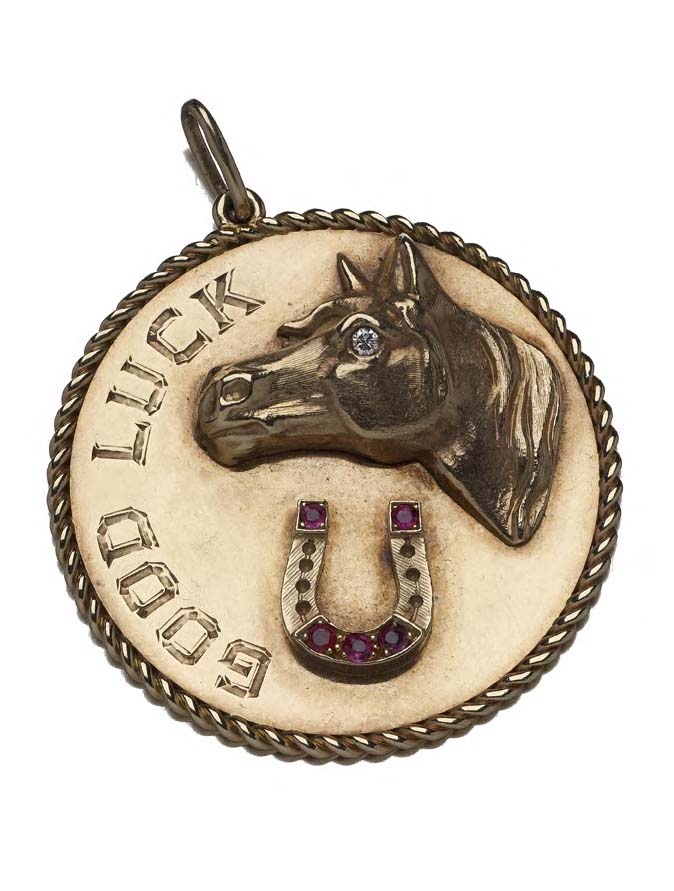 CARTIER - a gem set circular pendant,