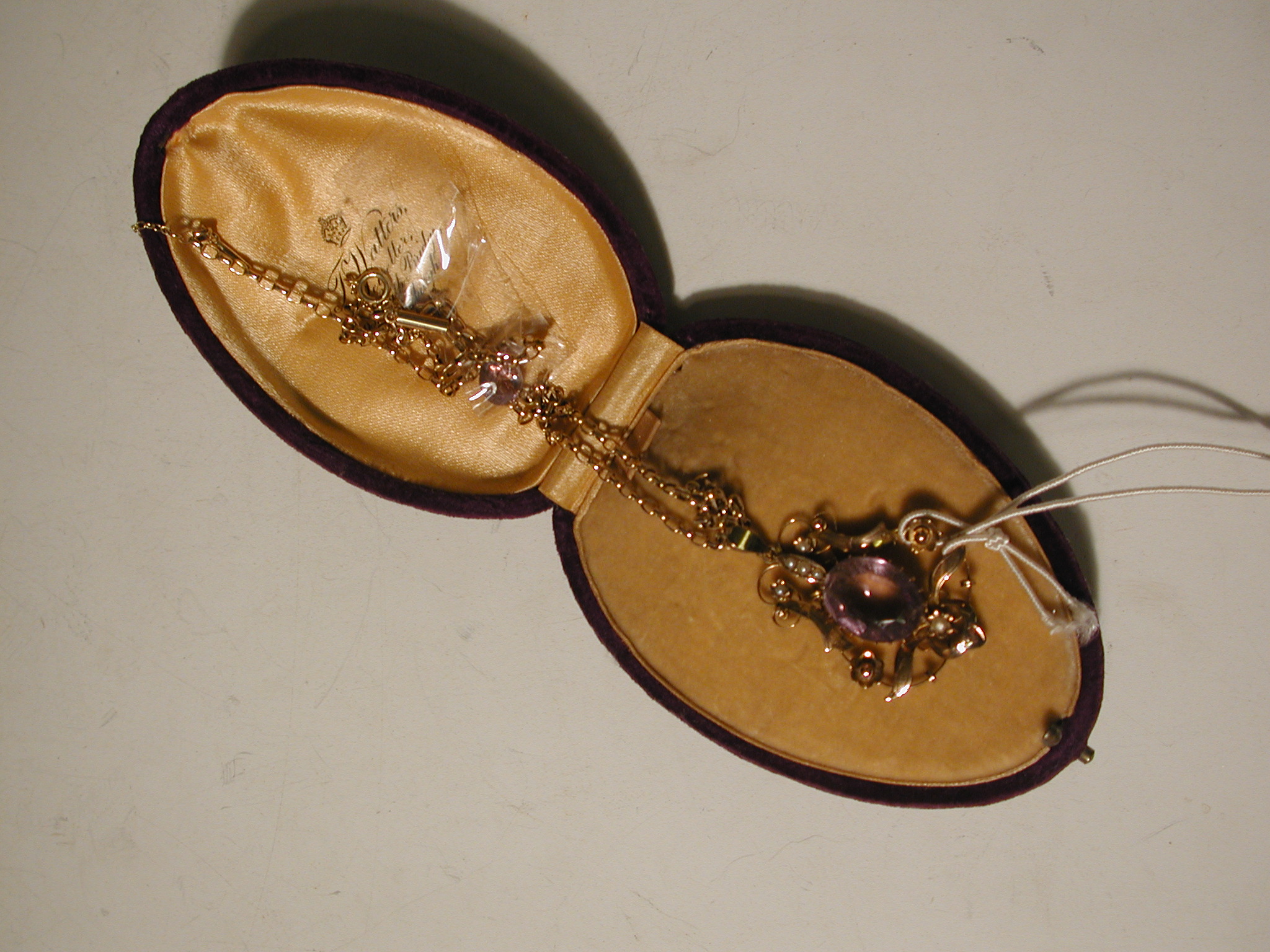 An Edwardian gold amethyst and pearl pendant necklace