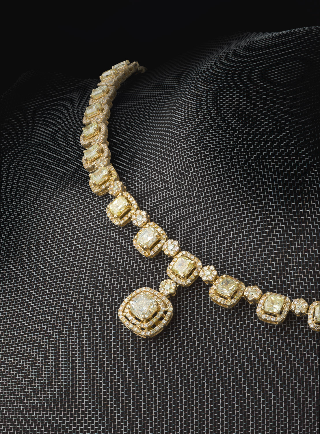 A contemporary fancy yellow diamond set necklace