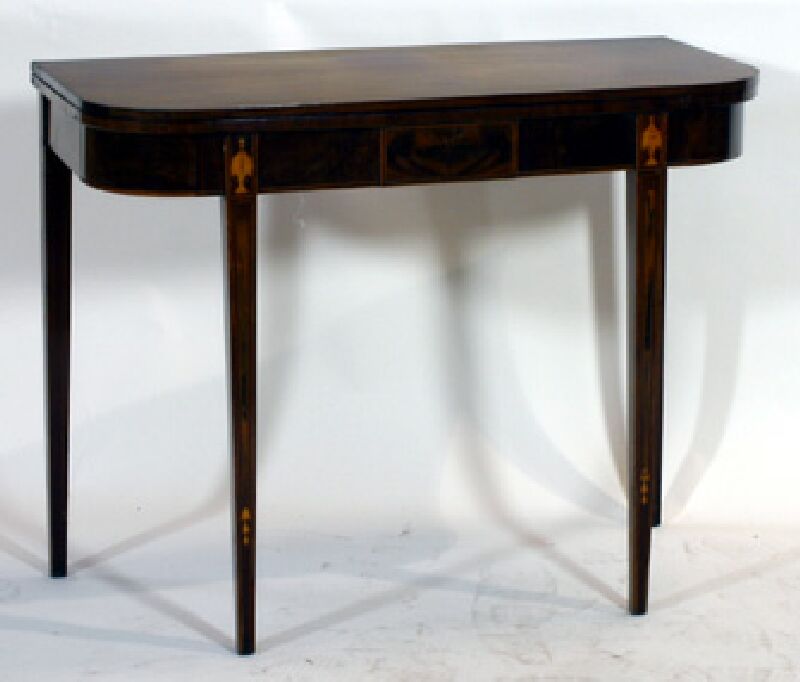 A late George III period mahogany and inlaid foldover tea table