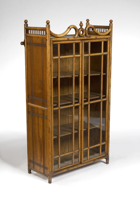 An unusual 19th century 'faux bamboo' ash and bentwood two door bookcase cabinet