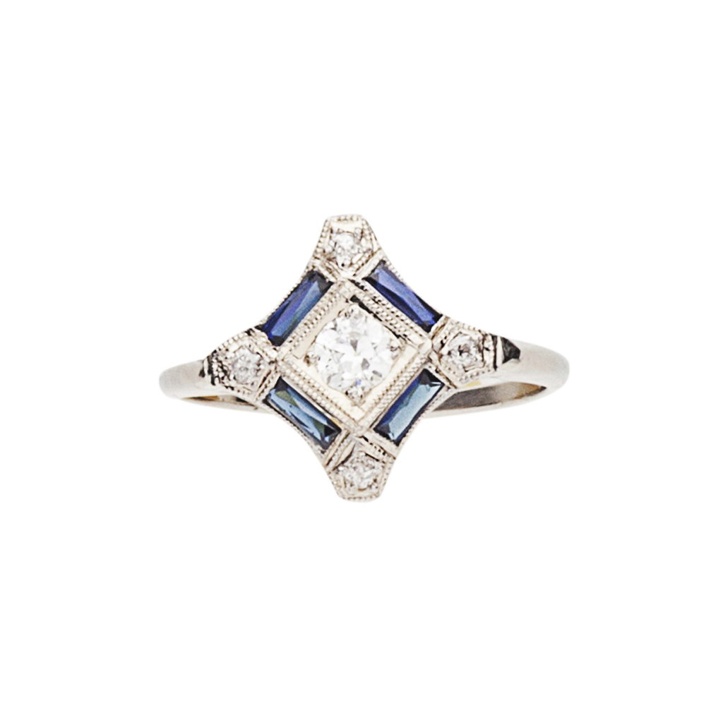 An Edwardian style diamond and sapphire ring