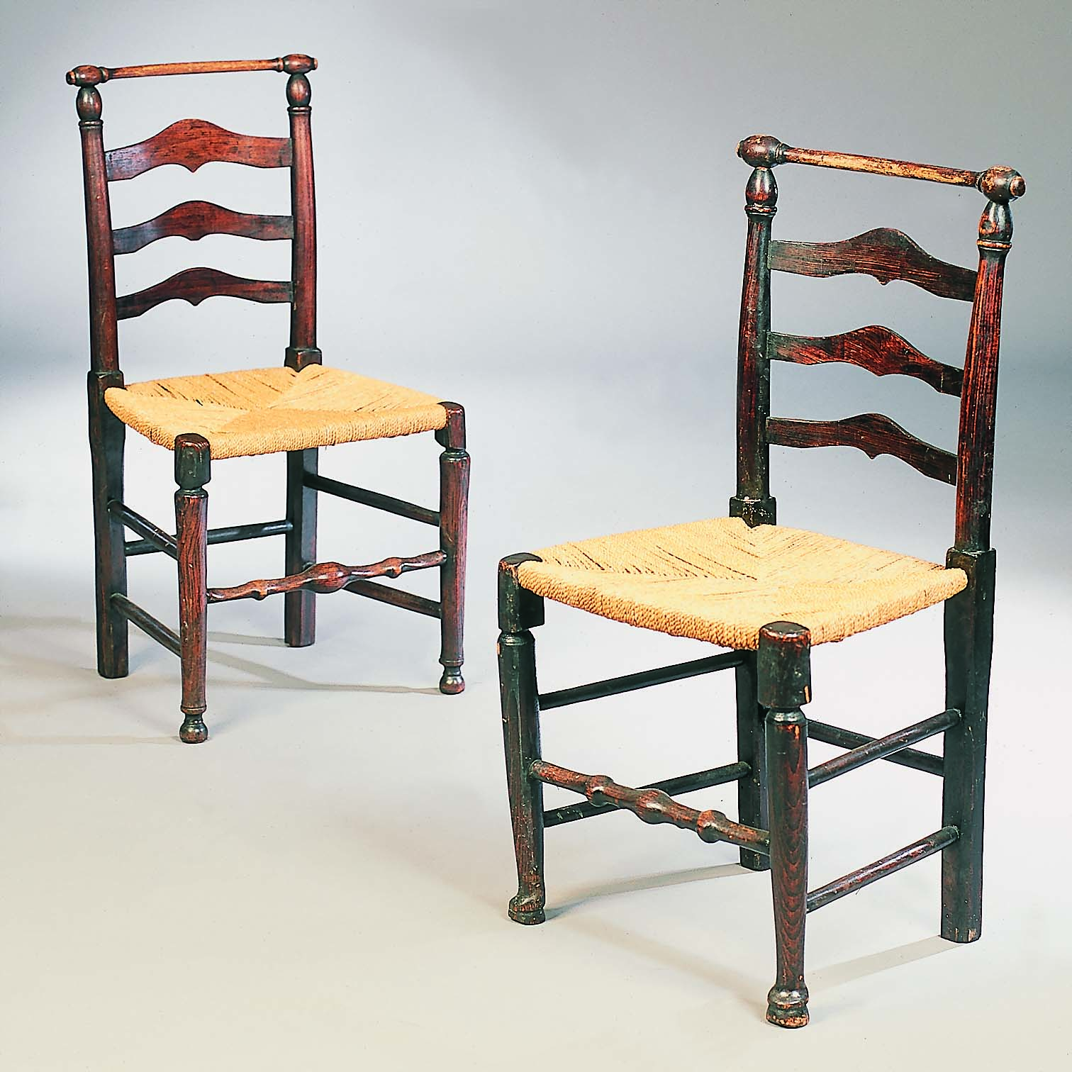 A harlequin set of seven ash and elm Wigan ladderback chairs