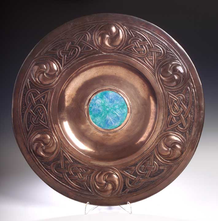 A Scottish Arts and Crafts copper wall plaque attributed to Margaret Gilmour,
