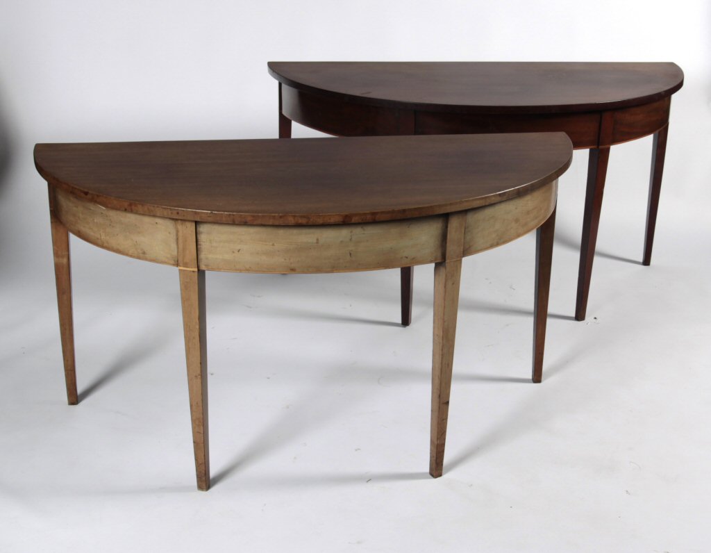 A pair of George III mahogany demi-lune tables