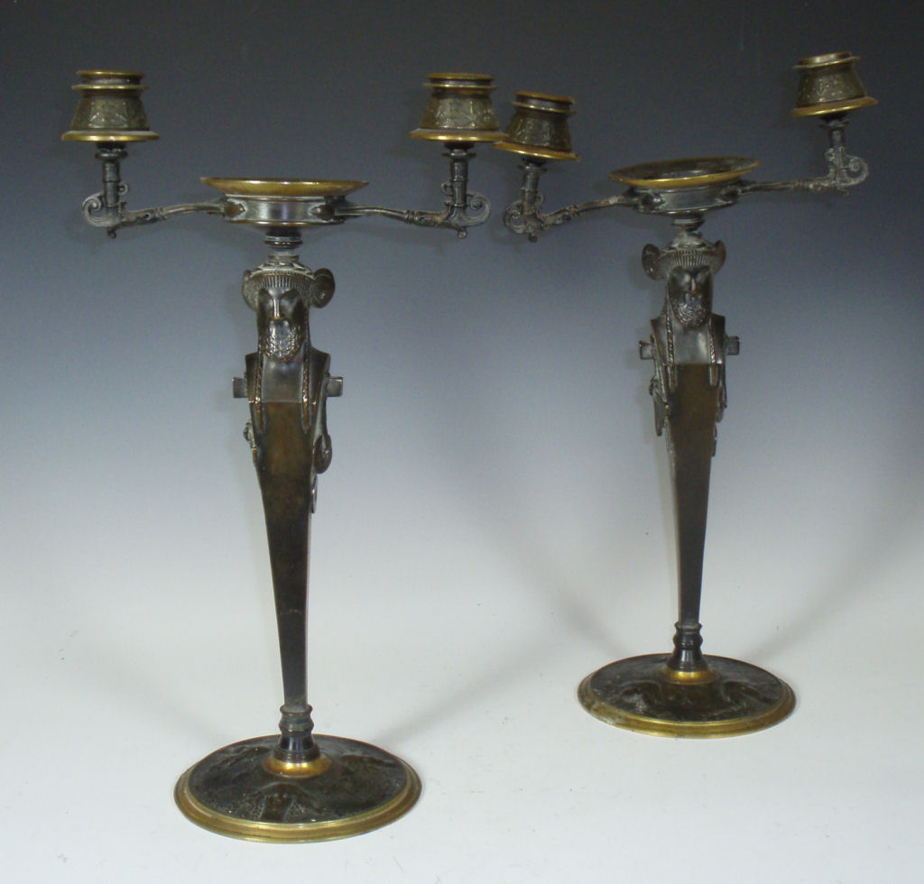 A pair of 19th century patinated and gilt bronze candlesticks