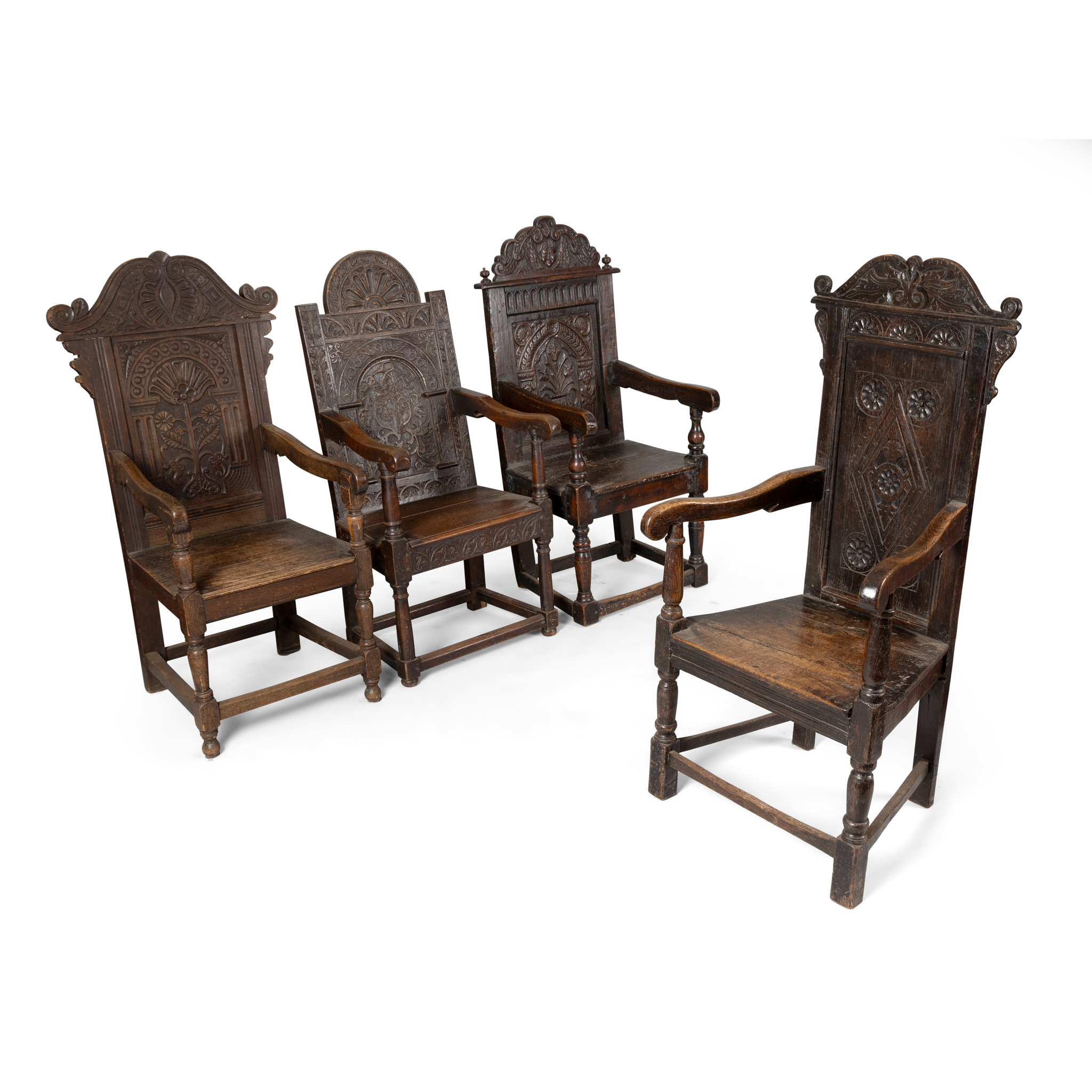 A COLLECTION OF FOUR OAK ARMCHAIRS