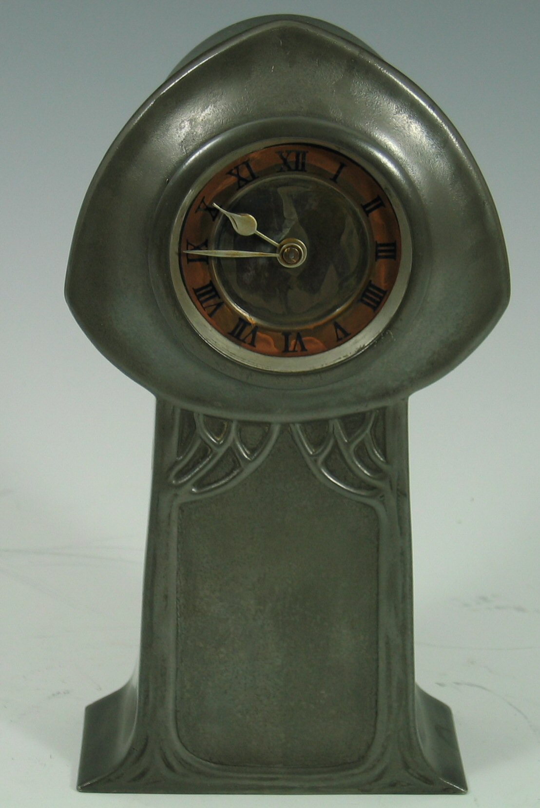 A Liberty & Co. pewter mantel timepiece,
