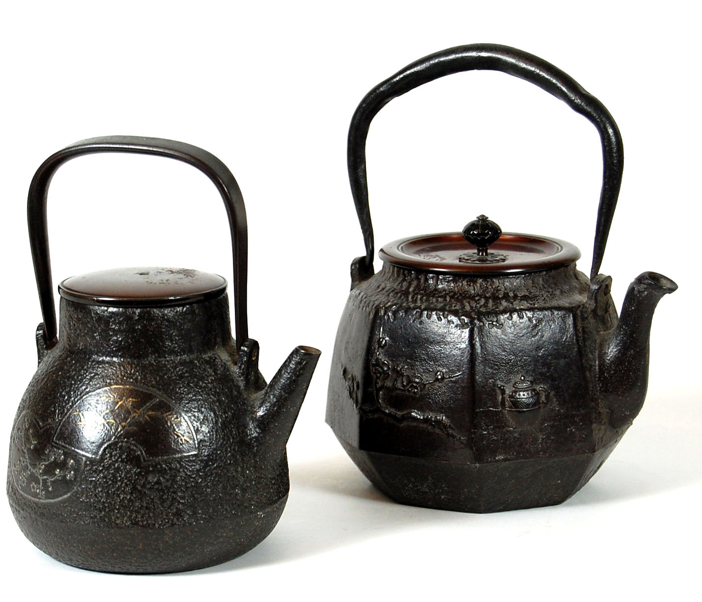 A Japanese iron tetsubin with mixed metal inlay, Meiji period