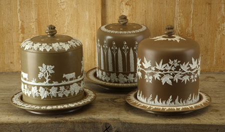 A brown jasperware cheese bell and stand