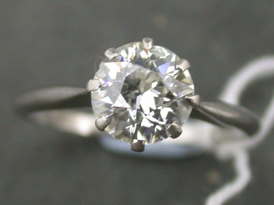 A platinum mounted diamond single stone ring,