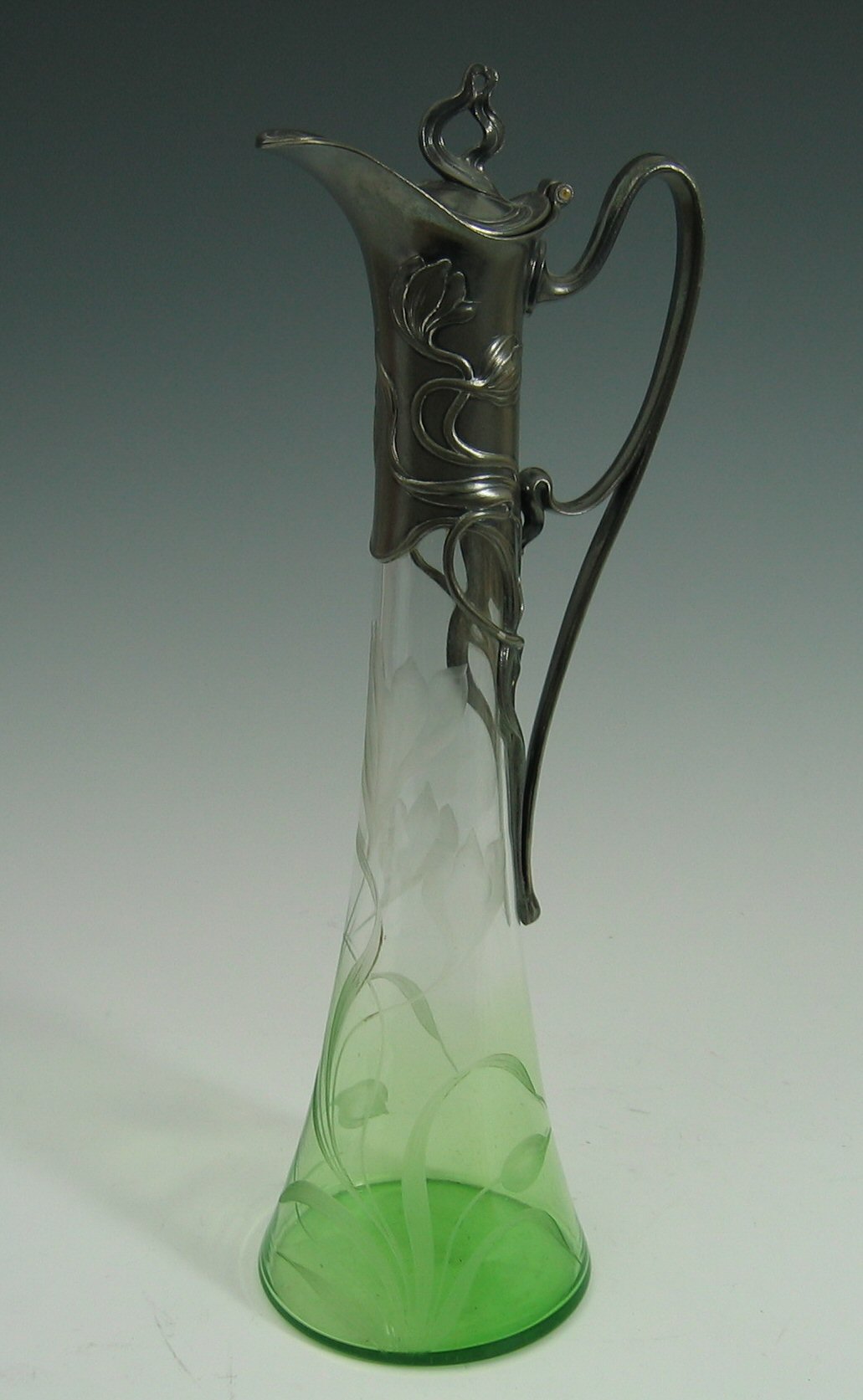 A WMF electroplated and glass claret jug,