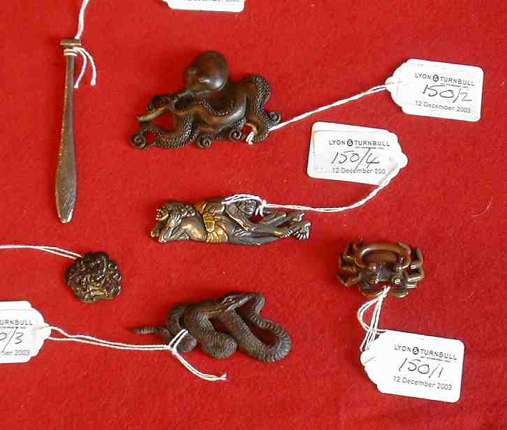 A group of Japanese bronze and other metal mounts