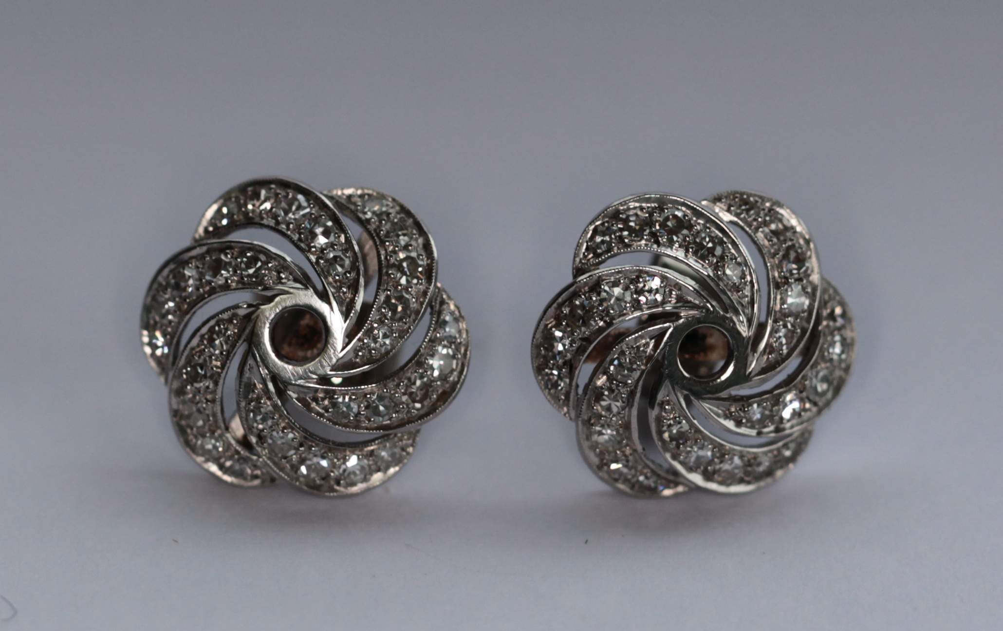 A pair of diamond set earrings